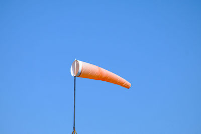 Low angle view of street light against clear blue sky