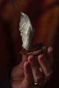 Close-up of hand holding ice cream