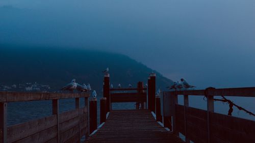 Pier over sea against sky