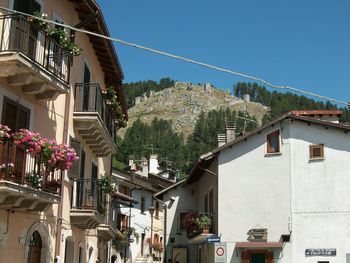 Town against clear blue sky