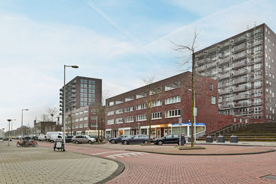 Buildings in city against clear sky