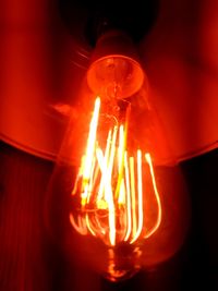 Close-up of illuminated light bulb