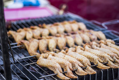 Close-up of meat on barbecue grill