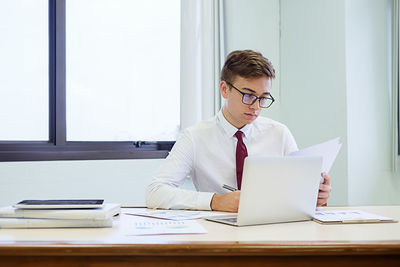 Businessman working at desk in office