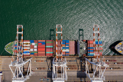 Container ship terminal, and quay crane of container ship at industrial port with shipping container 