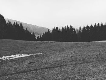 Scenic view of snow covered land against sky