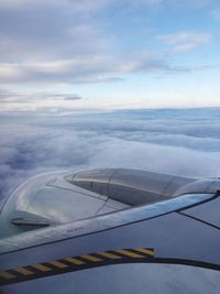 Airplane wing against sky