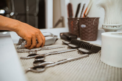 Cropped hand of person working on table