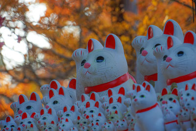 Close-up of toys against trees