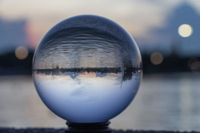 Close-up of crystal ball on glass