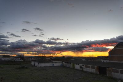 Scenic view of landscape against sky at sunset