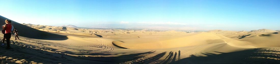 Panoramic view of beach against clear sky