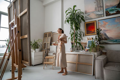 Portrait of woman standing in bathroom
