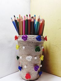 Close-up of colored pencils on table