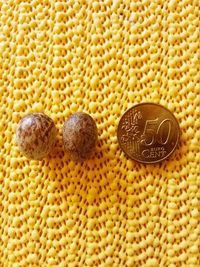 High angle view of coins on table