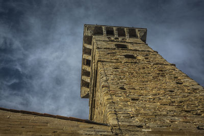 Low angle view of old building against sky