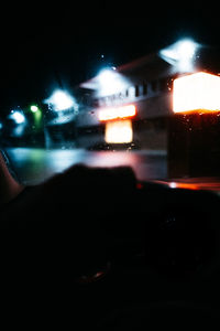 Illuminated street lights seen through car window