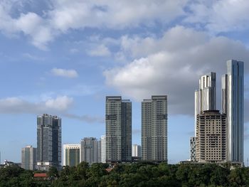 Modern buildings against sky in city