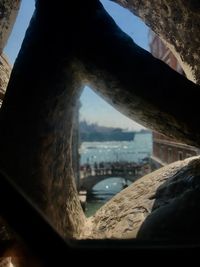 Close-up of buildings seen through window