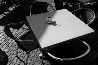 High angle view of empty coffee cup on table at cafe