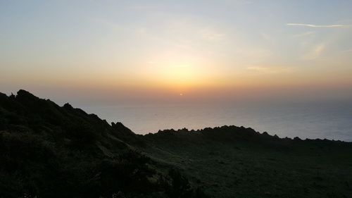 Scenic view of sea at sunset