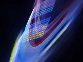 Low angle view of light painting against black background