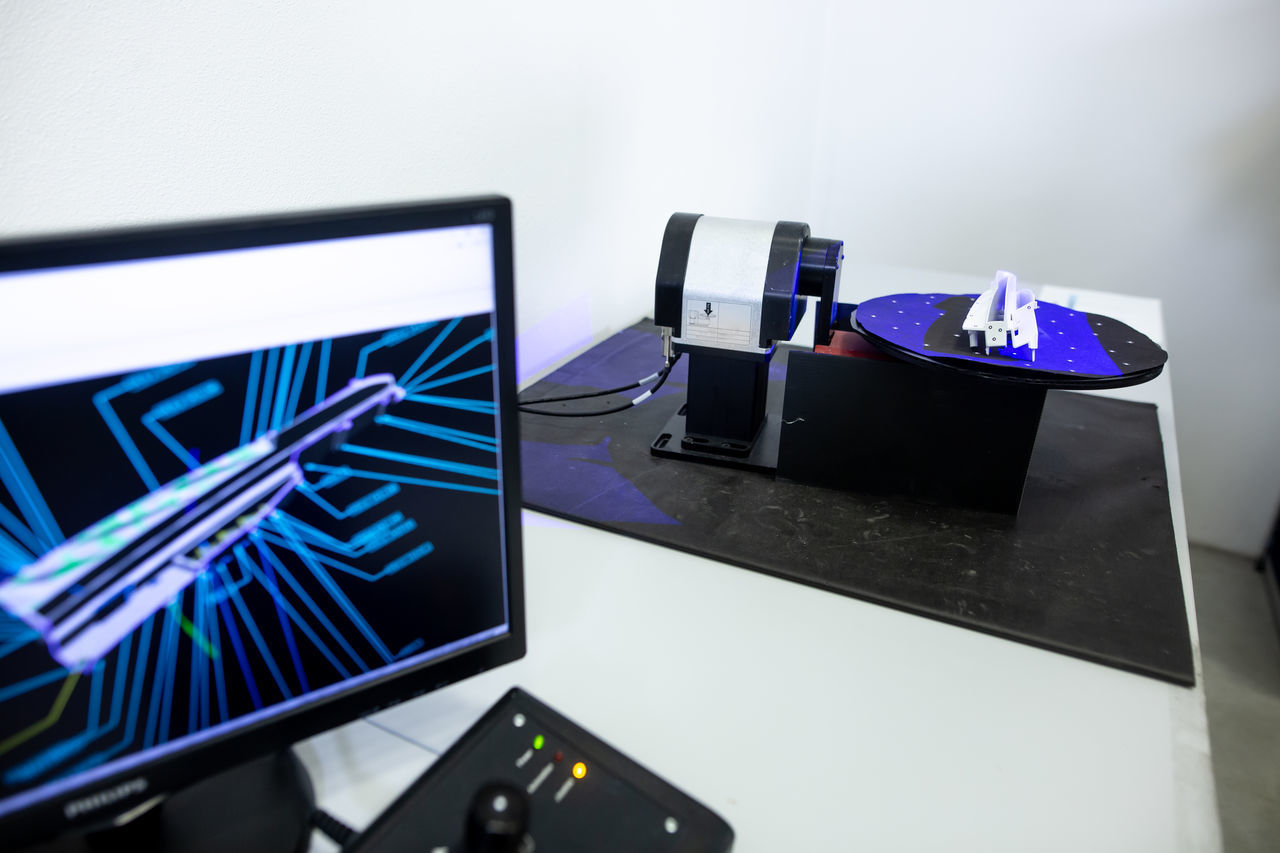 CLOSE-UP OF LAPTOP ON TABLE IN OFFICE