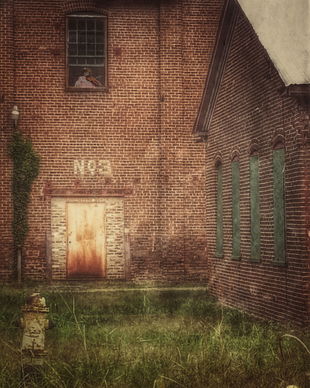 building exterior, architecture, built structure, brick wall, wall - building feature, house, abandoned, old, door, closed, weathered, outdoors, day, residential structure, grass, wall, no people, window, text, graffiti