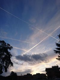 Low angle view of vapor trails in sky