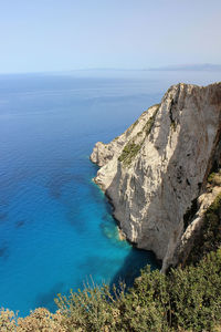 Scenic view of sea against clear blue sky