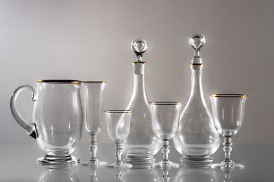 Close-up of wine glasses on table