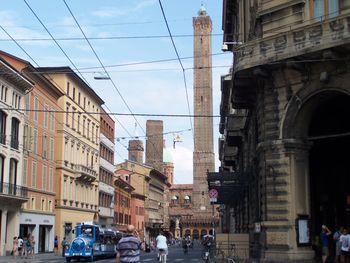 Panoramic view of people in city against sky