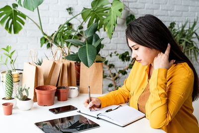 Woman sitting on table