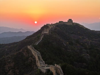 Scenic view of mountains against sky during sunset