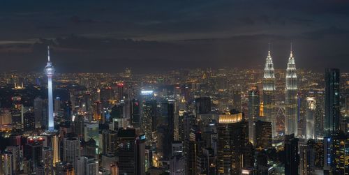 Aerial view of city lit up at night