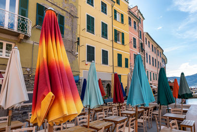 Low angle view of empty restaurant against buildings in city