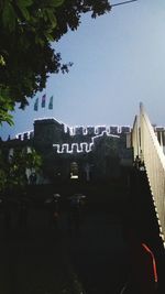 Buildings in city against clear sky