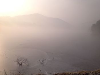 Scenic view of mountains in foggy weather