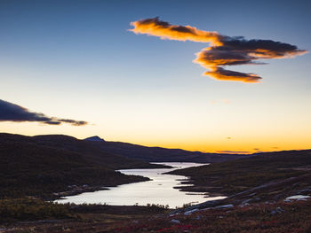 River in autumn landscape at sunset