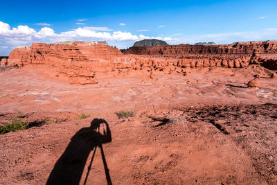 Rock formations on landscape against sky