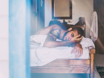 Young woman sleeping on bed