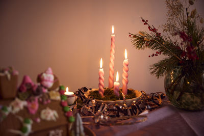 Lit candles and christmas decorations