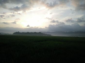 Scenic view of field against sky during sunset