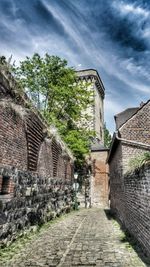 Cobblestone street against sky