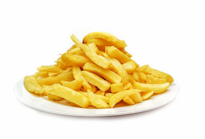 Close-up of food on plate against white background