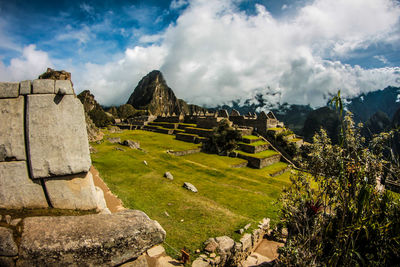 View of old ruins against cloudy sky