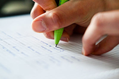 Close-up of hand holding book
