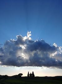 Low angle view of silhouette land against sky