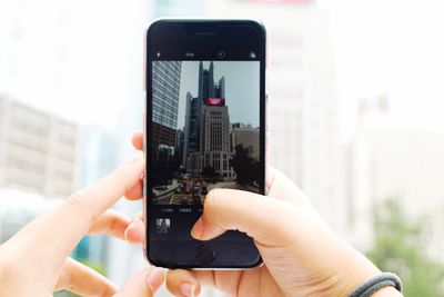 Close-up of person photographing