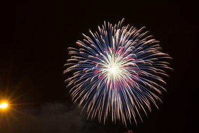 Firework display at night